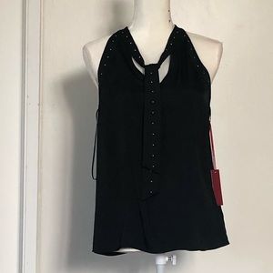 Jennifer Lopez black satin like blouse.